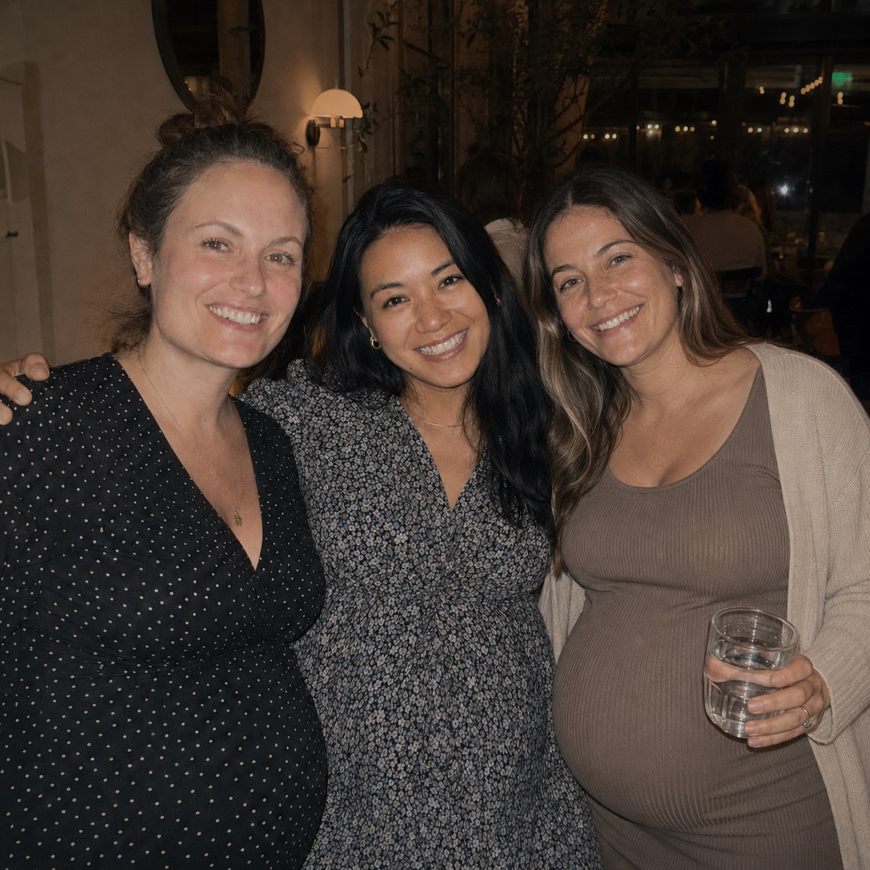 Three pregnant mums together at a SameStart dinner